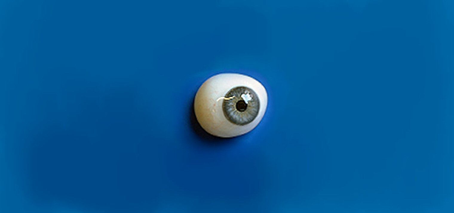 An Artificial Eye on a Blue Background