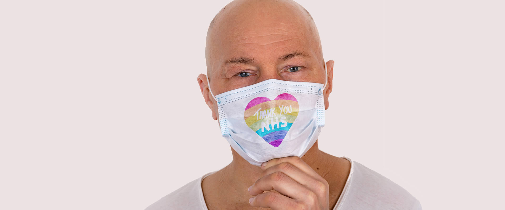 Man with an Artificial Eye wearing a Thank You NHS Mask
