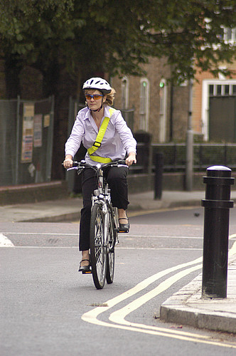 Woman wearing bike helmet.