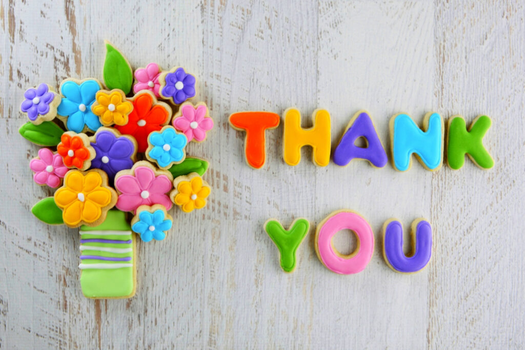 bouquet of felt flowers and the words thankyou made from felt