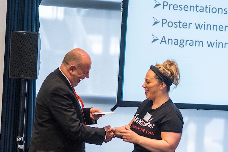 One of the tissue viability team picking up their prize for poster winner