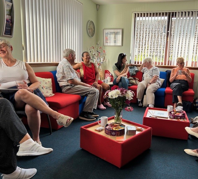 People participating in a coffee morning at Carers of West Lothian