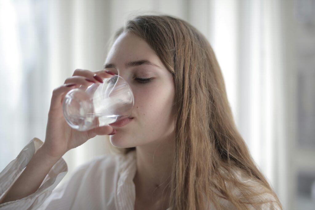 Women drinking water from a glass