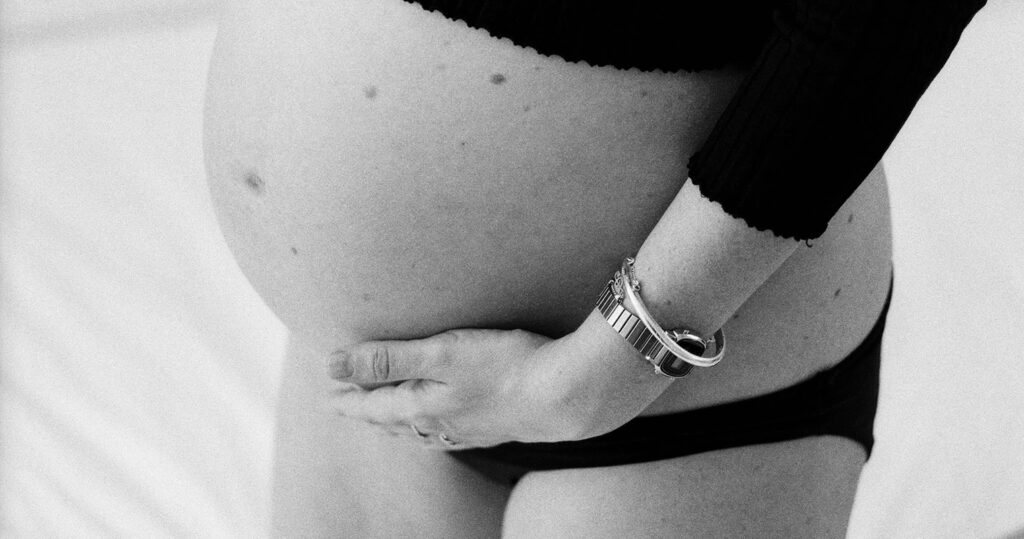 Female with pregnant belly