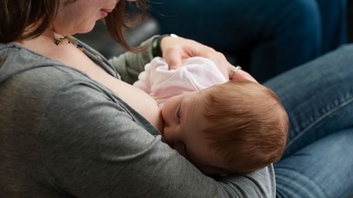 Woman breastfeeding a baby