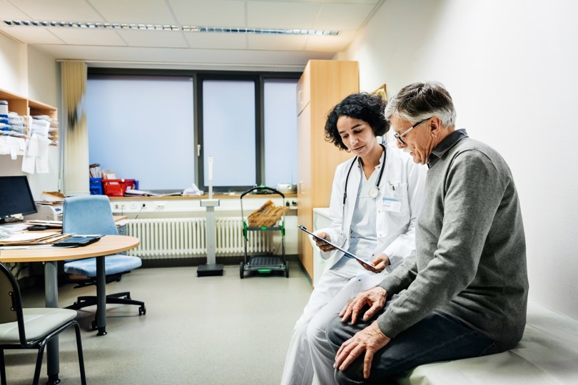 A doctor and patient sitting in a clinical room
