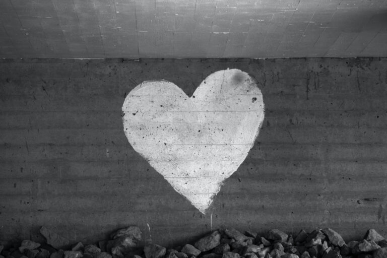 A graffiti heart on a brick wall