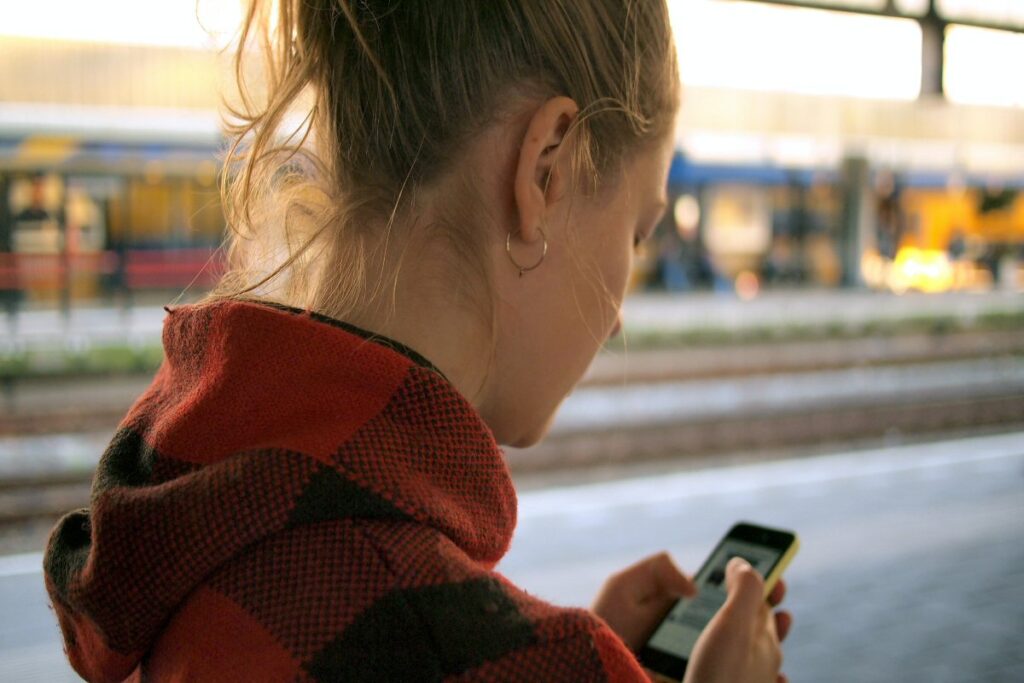 A female using a mobile phone